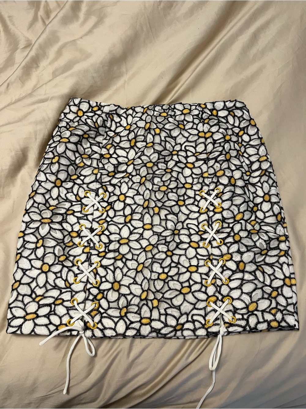 REVOLVE White Daisy Lace-Up Mini Skirt with Yellow Centers
